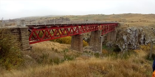 It may not look like it from here, but trust me from the middle of the bridge to the burn IS 121 feet straight down!
