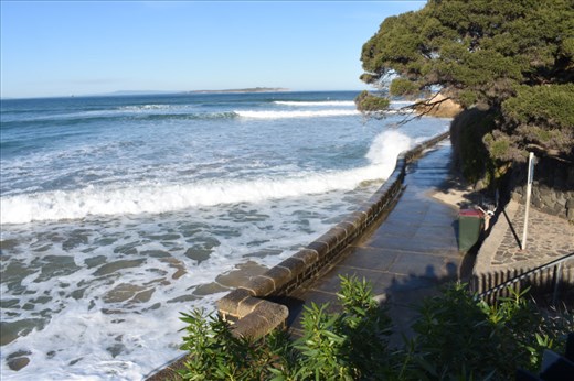 Just a little further on, the wave still foams whitely on the the wall.