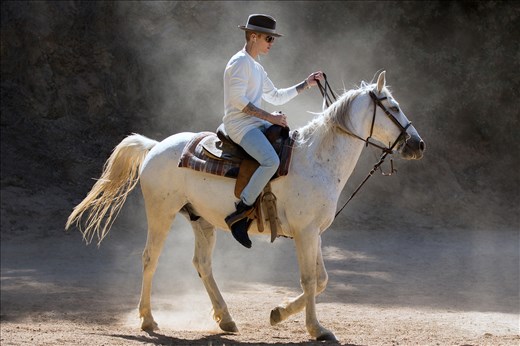 Justin Bieber riding a horse in the hills, escaping the pressure of Hollywood.