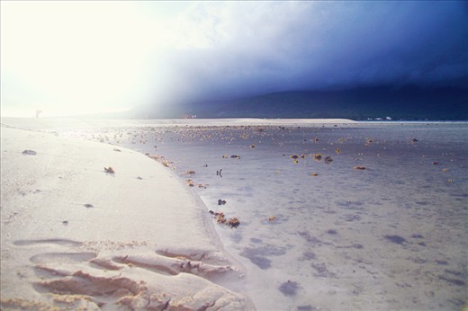 The most magical photo I've ever taken (overlooking the horizon and the beach) that day. The vanishing island was relatively small and anyone could simply walk the entire stretch of it in less than 5 minutes. This photo was taken from one of the corners of the island. I angled the camera to show the bright and dark parts of the sky which perfectly illuminated the shallow waters kissing the shoreline. 
