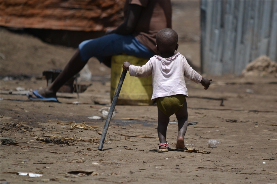 This picture was taken in KCC slum. It is a slum that has a lot of history, and unfortunately in January of 2012, had a fire that burned through most of the slum, leaving many homeless. We went there to visit the people who still lived there, and to see how they are rebuilding and what we would be able to do to help. I named this picture 