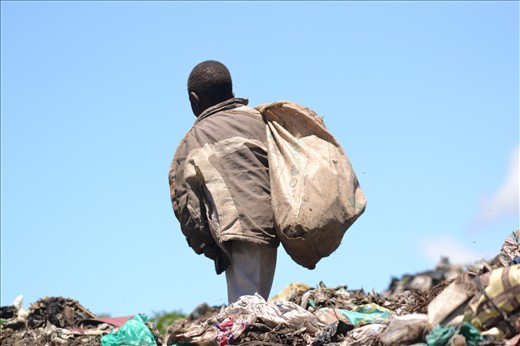 This picture is also at the garbage slum. This picture is of a boy who is on top of a heap of garbage, trying to collect things. The males in the slum were a lot more apposed to having their pictures taken because they did more of the climbing in garbage and searching through everything work. It is powerful to think that a boy has to spend his day looking through trash trying to help his family survive, and seeing it was one of the hardest things i had to do on my trip. 