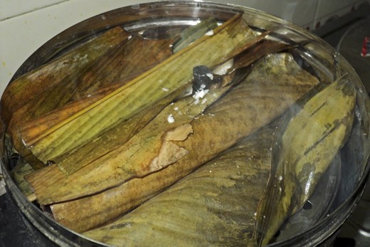 Fold the leaf and put it on the idli maker.