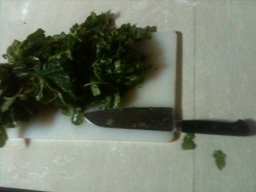 Chopping the spinach finely