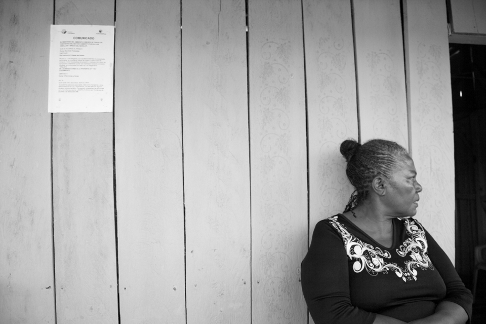 Many refugee families lack a source of income, yet fishing along the mangroves provides self-sustenance as well as products to sell at the local market. Unfortunately, Ecuadorian authorities claim that the communities here are exploiting mangrove resources and must be evicted. In this photo, a notice on the wall warns residents of actions to enforce their eviction.