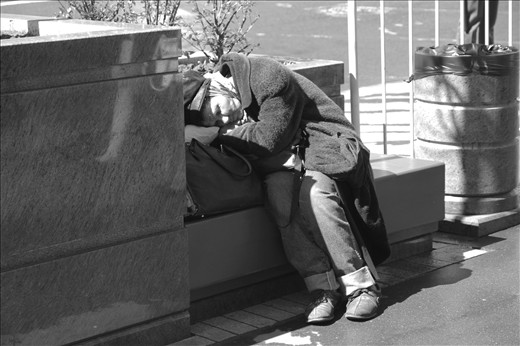 Moscow, Russia: homeless old woman sleeping on Tverskaya street during the parade rehearsal on 7th of may, 2013