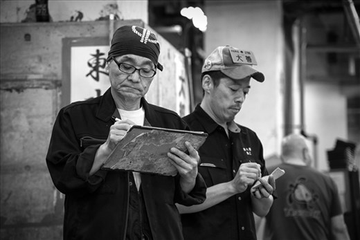 Within a flash, the auction is over but there is no time for a rest. The auctioneer records the auctioning details for the day. Successful sales of tunas are then loaded immediately into turret trucks that are parked at the bay and are delivered to their respective destinations.