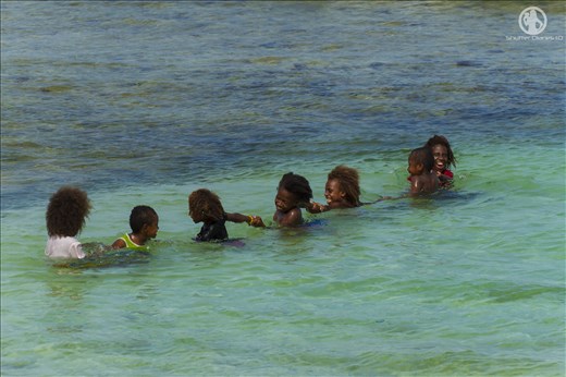Local children having fun in the lagoon
