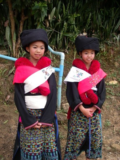 The children in traditional dress welcome us to the celebration
