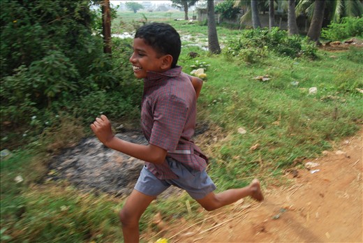 Gorgeous homeless boy chasing after our bus as we leave the Children's Home.
