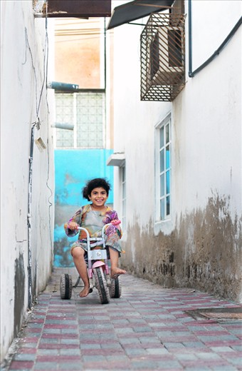 Despite simplicity of living in Muttrah even the simple toy, there is a smile.