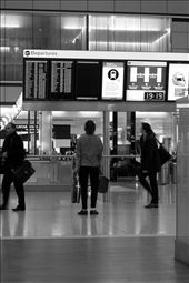 Finding my way Home - A traveler checking his flight information on the display at London Heathrow Airport. Its one of the most busiest airports in the world: by thebookoftravel, Views[673]