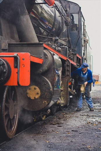 3.	Brendan doing his routine procedures on the J515 locomotive once the train is stopped at Maldon station. He does this for all the trains after each journeys and he is very experienced in this profession. One look at his hands, you realize this man knows the steam rail inside out. He is very passionate about the rail system and knows all the trains and their history by heart. Brendan and his colleagues work hard to put the train running as much as possible so more guests can enjoy the journey. Their motivation stems from the love of steam trains and the joy of customers.