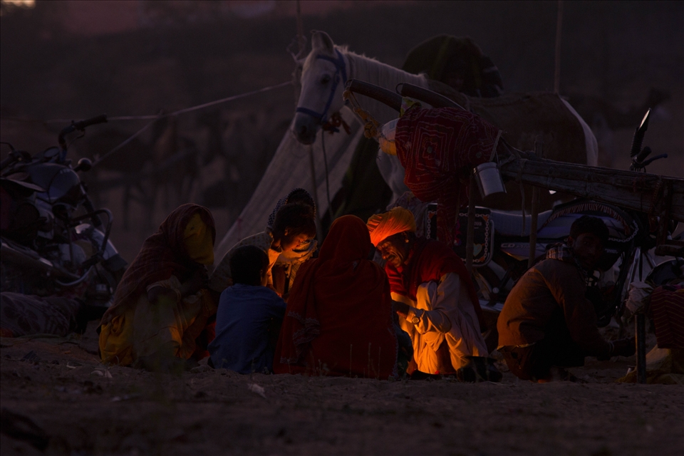 A light that travelled so far - There was more to this early morning than a night that woke up from its dreams. I saw this traveller’s family inviting the Sun from the ground. Their dreams, their hunger and their greater lives everything started brightening up in front of my lens.
