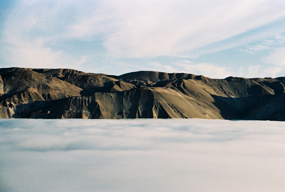 Driving over the top of the clouds towards Bolivia in the Andes Mountains Chile.