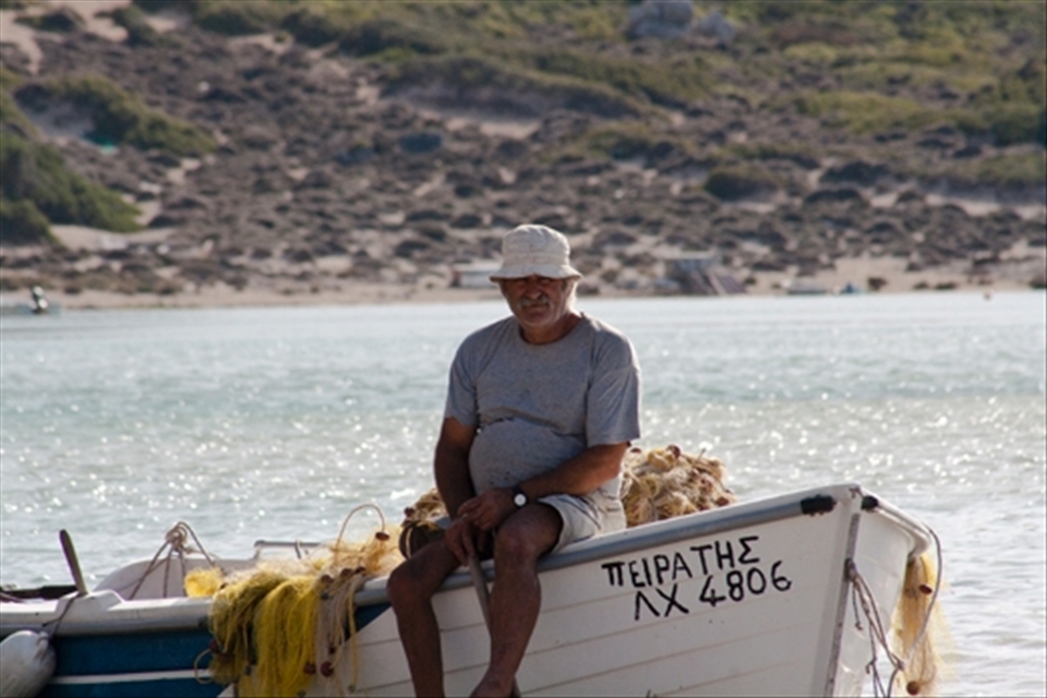 A local fishing for his families restaurant. Crete, Greece.