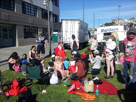 Santa at christmas fayre with parents of deaf children