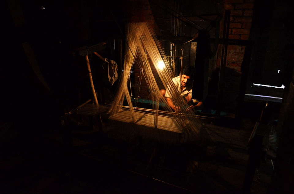 Silk weaver worksby lamp light