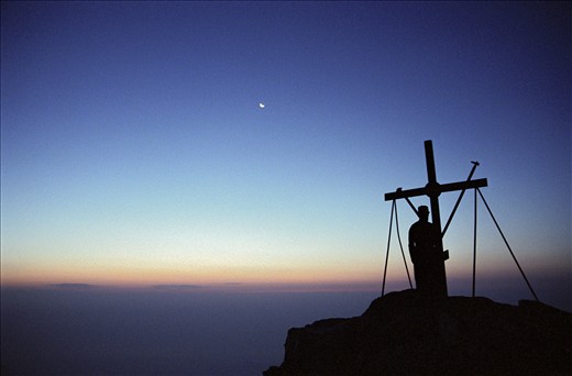 At the sweet sunrising in front of the big cross of the top, meditating to the Lord of the sun and of the whole world,feeling him near your body and soul,in the total silence and peace.