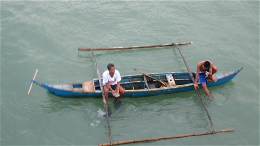 Gyspies at Matnog pier waiting for ferry passengers to throw coins.