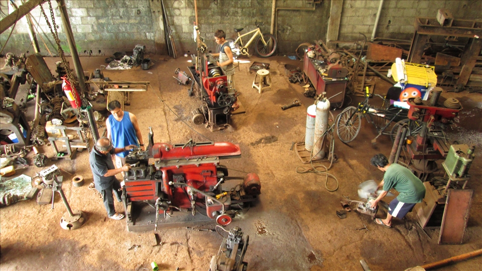 Men working at a machine shop in Tacloban City.