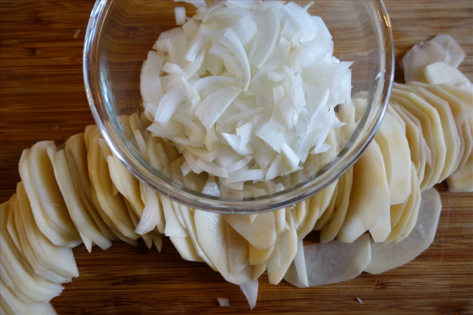 Sliced potatoes and onions ready for cooking