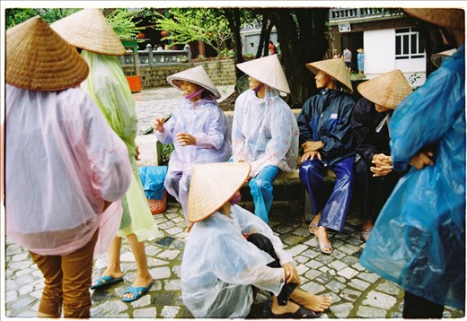 The ferrywomen are laughing and talking to each other when they see us coming to them. As usual, they will take people on the ferry and steer the ferry about 10 kilometers to visit Trang An caves and valleys. 