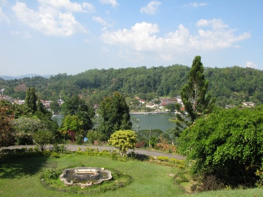 the view from Castle Hill Guest House, Kandy.  You can see the Kandy Lake and the temple of the tooth relic in the distance.. we had curtains and it was cool at night. Finally, the family slept.