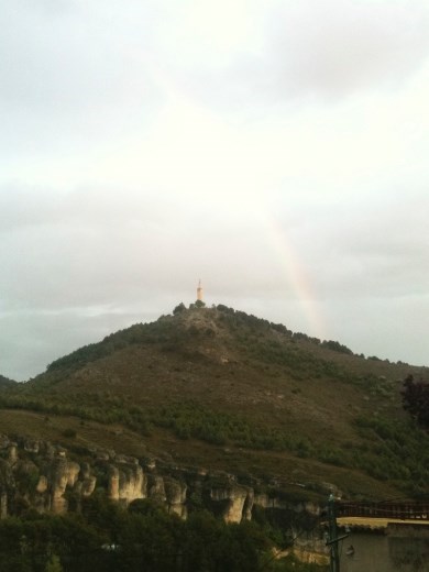 The Christ statue with a rainbow.