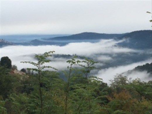 Cycle ride on Parenzana trail. View over to Motovun through the clouds
