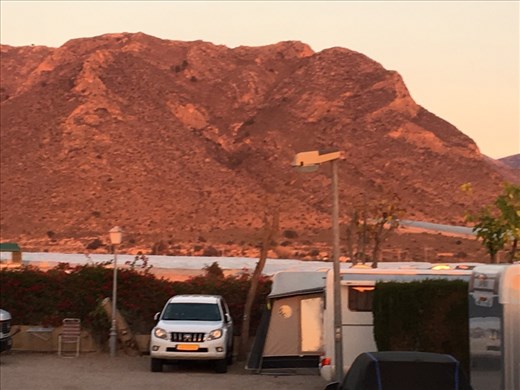 Sunset over hills at campsite
