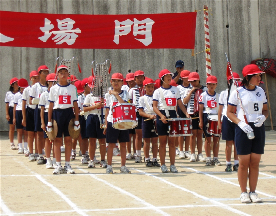 Pupils from Iino Elementary School in marching position during their Sports Day.