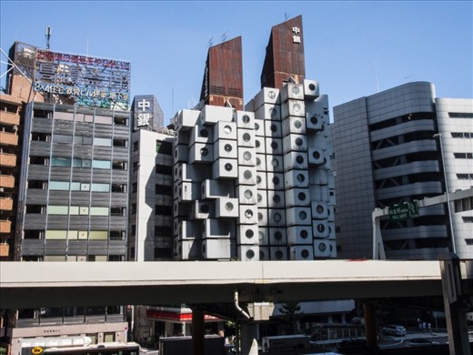 Nakagin Capsule Tower, 1972.

Tokyo urban landscape is shaped by history of war and natural disaster and continual process of restructuring and growth.

This eccentric residential and office building which looks like stack of washing machines is an icon of the postwar Metabolist movement. It is now in a state of disrepair and it is due for demolition and redevelopment. 
