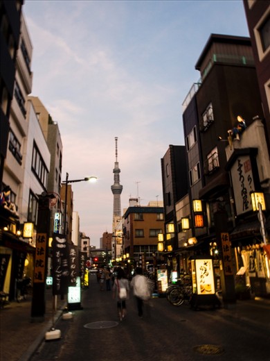 A glimpse of new Sky Tree Tower, the tallest tower in the world from a street along downtown Tokyo, Asakusa area. As welll as revitalising the Asakusa surrounding area and Tokyo’s skyline, the tower’s completion a year after the earthquake and tsunami disaster is seen as a sign of nation’s recovery.