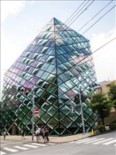Prada Flagship store 2003. 
Tokyo’s Omotesando Boulevard is a stunning catwalk of high-end contemporary fashion and dramatic architecture build in the 2000s. To make a fashion statement in Tokyo, it’s no longer enough to create a shop interior. This store stands out, a building type that is part billboard and part architectural gift-wrapping.
: by thidatint, Views[3173]