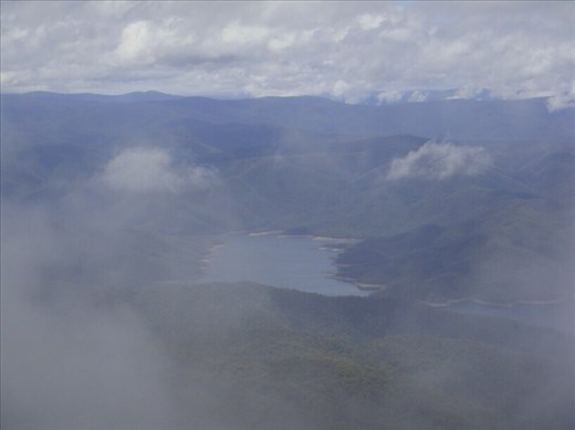 Lake Dartmouth peeking through the clouds, on Mt. Benambra, Vic