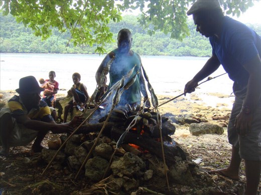Having a picnic, roasted fish and bananas, Lumbumbu Bay, Malekula.