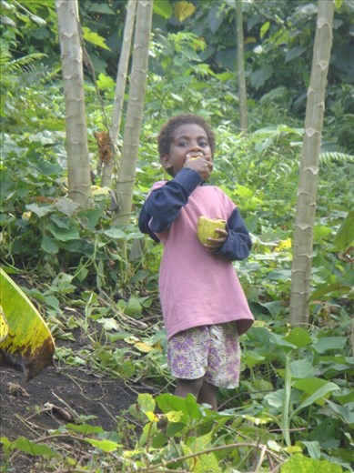 Ashila (also my sister) enjoying sweet cacao beans, Caroline Bay, Malekula.