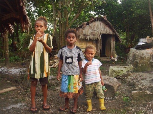 Drashila, Ashila and Elieta eating crab, Caroline Bay, Malekula.