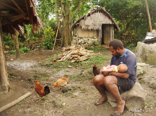 Chanel with Gianne, feeding the chooks, Caroline Bay, Malekula.