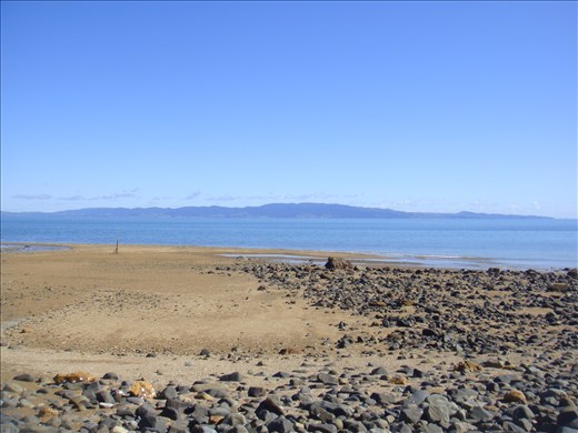Peach coloured beach, East coast Coromandel Peninsula.