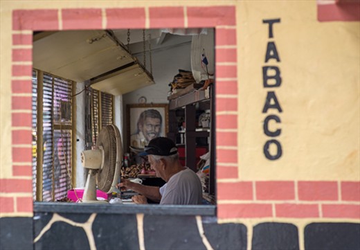 On the outskirts of Casco Viejo, a cigar maker works in his small shop.
