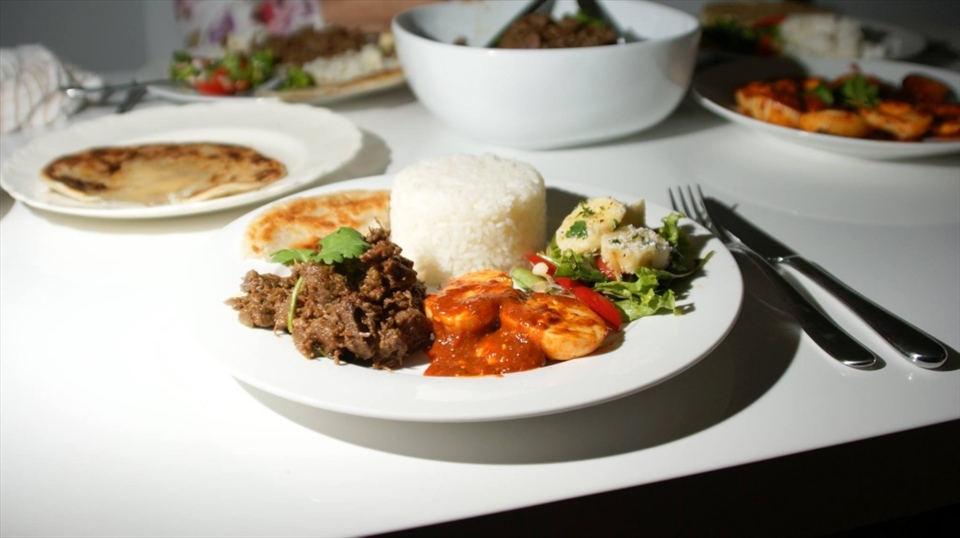 Beef Rendang served with with Telur Balado (spicy eggs), and a selection of light salads and rice.  