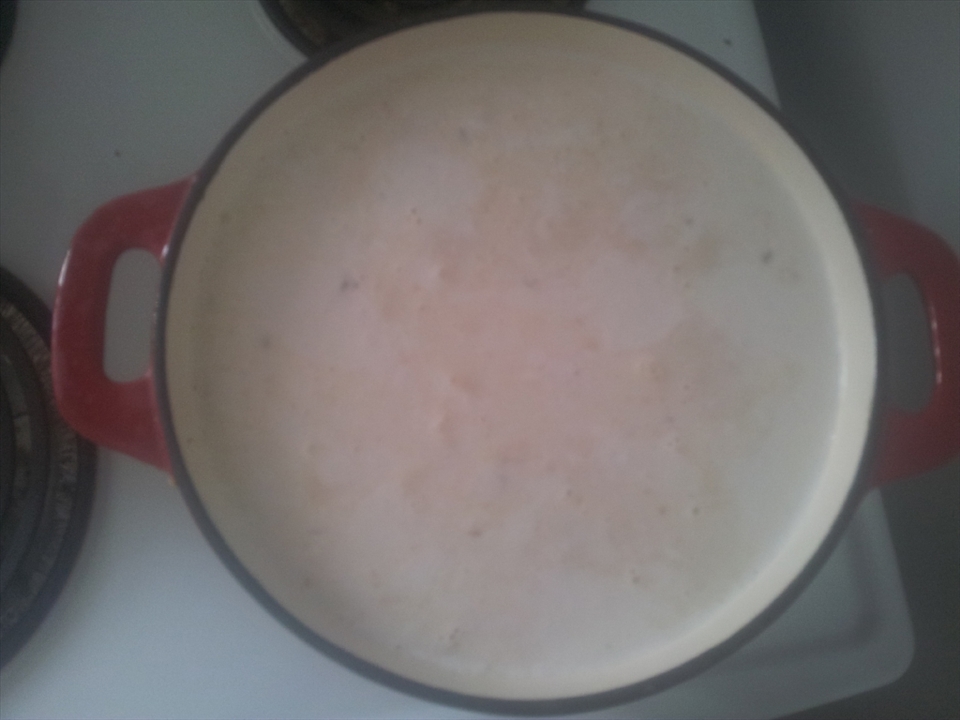 Add meat and spice paste to boiling coconut milk. Add in the remaining beef stock, turmeric leaves, lime leaves, bay leaves and lemon grass. The look of the Rendang will change drastically over the cooking period. 
