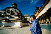 A female Tibetan pilgrim doing kora around the Gyantse Kumbum. The Kumbum or great gomang (many-doored) chorten at Gyantse is a three dimensional mandala, meant to portray the Buddhist cosmos. The Kumbum, like other mandalas, which are portrayed by a circle within a square, enables the devotee to take part in the Buddhist perception of the universe and can depict one's potential as they move through it. Mandalas are meant to aid an individual on the path to enlightenment.Gyantse, Tibet.: by tibetya, Views[1038]