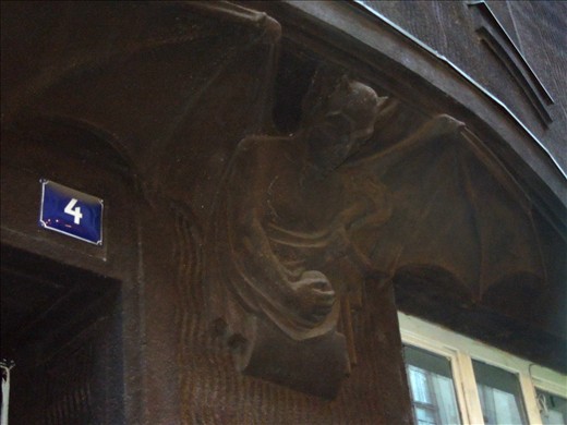 The devil residing over the entrance to the alchemists' house~