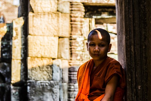 This child monk was an incredible character. He told me he lived in Siem Reap and came to the Angkor temples everyday. He seemed much too serious for his age but showed no sign of animosity to the fact. He spoke much better English than i spoke Khmer, so I was able to ask him to help me compose the photograph among the busy temple. He seemed to like the final result.