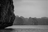 Ha Long Bay. We had been told that during winter Ha Long Bay in northern Vietnam would be dull. The fog that descended on the bay every morning was far from boring. It created a fantastic separation between foreground interest and the endless myriad of islands in the background. Using a wide aperture, this separation was emphasised further to create an image with several layers.: by tim8836, Views[533]