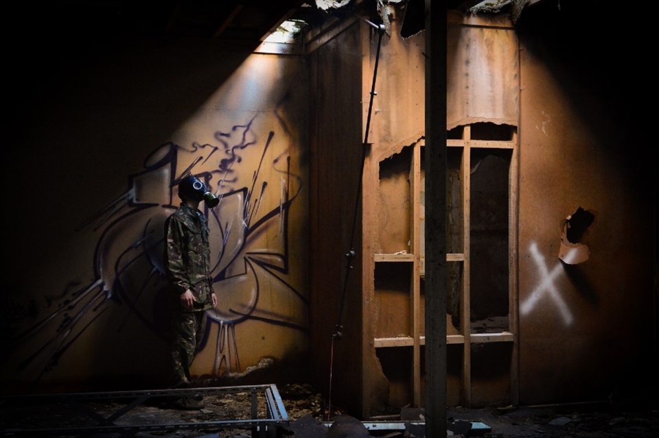 In the tunnels under the Asylum we find a break in the floor above us. The very welcome sunlight creeps  through to light my fellow explorer. 