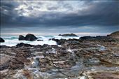 View over the rocks to Godrevy Lighthouse with approaching storm clouds. : by timhunt, Views[346]